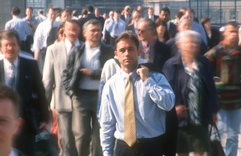 BUSINESS, Commuters, City businessman in shirt and tie holding suit jacket over his shoulder
