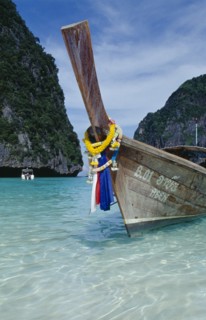 THAILAND, Krabi Province, Ko Phi Phi Leh , Maya Bay.  Close view of prow of long tail boat draped