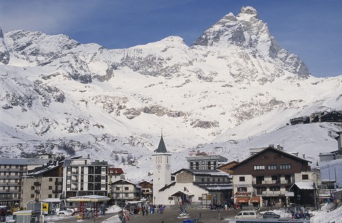 ITALY, Valle d’Aosta, Breuil Cervinia, "Ski resort town with church, hotel and petrol pumps with