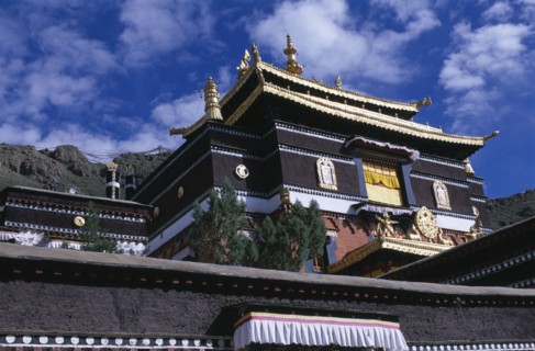 CHINA, Tibet, Shigatse, Tashilhunpo Monastery exterior with golden roof dating from 1447.