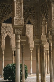 SPAIN, Andalucia, Granada, Alhambra Palace.  Detail of arches lining the Patio de los Leones.