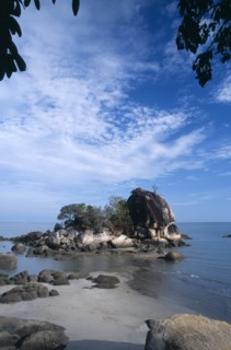 MALAYSIA, Penang, Batu Ferringhi, Batu Ferringhi or Foreigners Rock rising out of shallow water