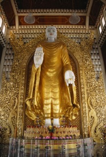 MALAYSIA, Penang, Georgetown, Dharmikarama Burmese Temple.  Interior with large standing Buddha