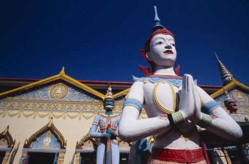 MALAYSIA, Penang, Georgetown, "Wat Chayamangkalaram.  Exterior, temple statues with part view of
