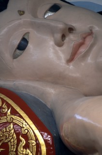 MALAYSIA, Penang, Georgetown, Wat Chayamangkalaram.  Interior.  Detail of face of  thirty-two metre