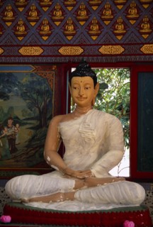 MALAYSIA, Penang, Georgetown, Wat Chayamangkalaram.  Interior with seated Buddha figure in