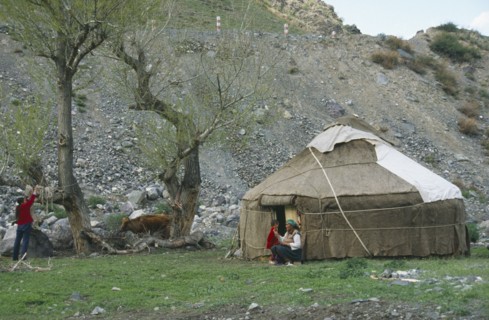 CHINA, Xinjiang , Tianchi, "Kazakh Yurt, tent, with women and young boy outside"