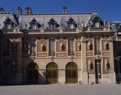 FRANCE, Ile de France, Yvelines, "Versailles. Part of palace with statues on walls, arches,