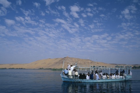 EGYPT, Upper Egypt, Aswan, Qubbet el-Hawa and The Tombs of The Nobles with a loaded  passenger