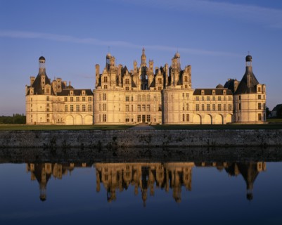 FRANCE, Loire Valley Centre, Loir et Cher, "Chateau Chambord in golden light, reflected in moat in
