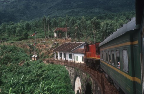 VIETNAM, Hai Van Pass , View from train along carriages as it crosses a bridge surrounded by lush