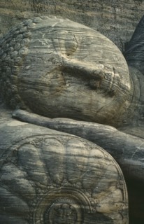SRI LANKA, Polonnaruwa, Stone carved reclining Buddha detail of head lying on hand