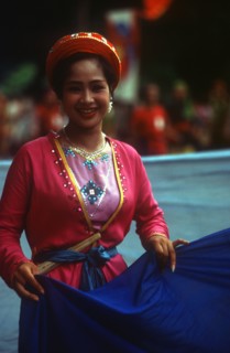 VIETNAM, Hanoi, "Young woman at National Day celebrations, threequarter body shot."