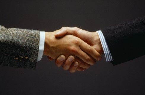 BUSINESS, Handshake, Close up of two men shaking hands as a greeting