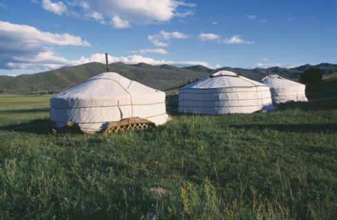MONGOLIA, Khentii Province, General, Gers in mountain landscape.