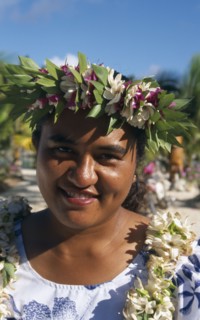 PACIFIC ISLANDS, Cook Islands, Aitutaki, Portrait of a woman wearing a garland