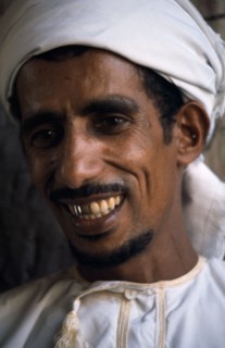 OMAN, People, Men, Portrait of man wearing white turban smiling