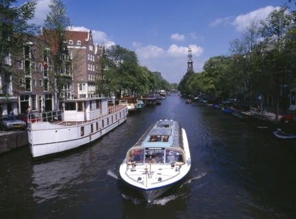 HOLLAND, Noord, Amsterdam, Glass top tourist boat travelling down the Prinsengracht canal