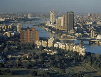 EGYPT, Cairo Area, Cairo, Elevated view looking Northwest over the Nile with tall city buildings