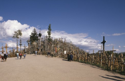 LITHUANIA, Hill of Crosses, "Visitors at ancient pilgrimage site of hill near Siaulial covered with