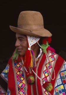 PERU, Cusco, Vilcanota, Portrait of boy from Tinqui wearing typical hat and poncho.