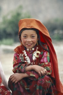 AFGHANISTAN, Children, Portrait of Kirghiz girl in traditional dress.