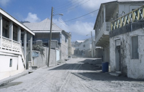 MONSERRAT, Plymouth, Housing covered in layer of volcanic ash after 1997 eruption.