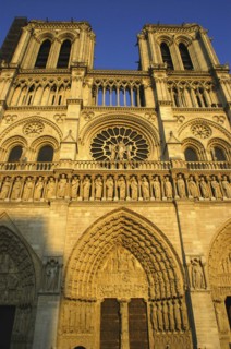 FRANCE, Ile de France, Paris, Angled view looking up at the west facade of the Notre Dame cathedral