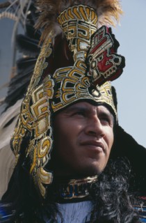 MEXICO, Mexico City, Our Lady of Guadaloupe Festival male Indian dancer outside the Basilica