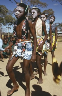 TANZANIA, Festivals, Makonde girls wearing ritual face whitening and dancing during female