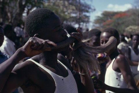 TANZANIA, Dodoma, Ngomas dancers using an animal horn as a musical instrument