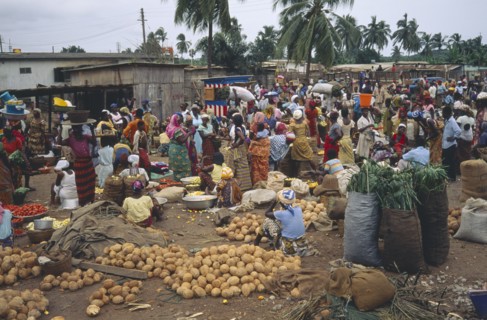 GHANA, Accra, Crowded market scene in village near Accra with mixed produce.