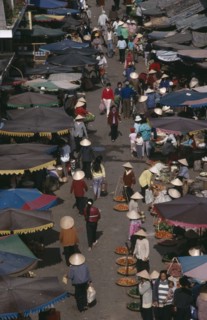 VIETNAM, South, Nha Trang, Market scene from above with people in conical hats walking amongst