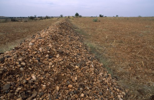 INDIA, Andhra Pradesh, Anantapur, Pebble bund made to catch rainwater runoff