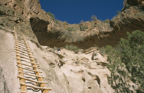 USA, New Mexico, Bandalier, Wooden ladder into Anasazi Indian cave dwelling in the national