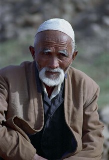 CHINA, Xinjiang, Kashgar, Portrait of a man wearing a cap