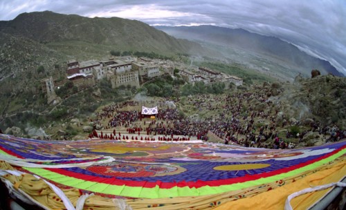 CHINA, Tibet, Drepung Monastery, Wide angled view looking down massive colourful image of buddha to