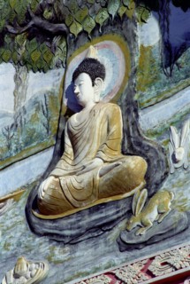 LAOS, Savannakhet, Wat Sainyamungkhun. Buddha carving in the temple wall