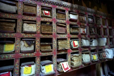 INDIA, Ladakh, Tikse, Scriptures on shelves with each pocket holding a chapter at Tikse Gompa