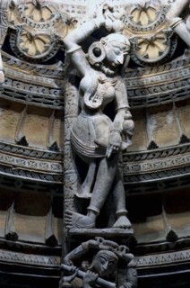 INDIA, Rajasthan, Mt Abu, Decorative carved marble figure at one of the Dilwara Temples