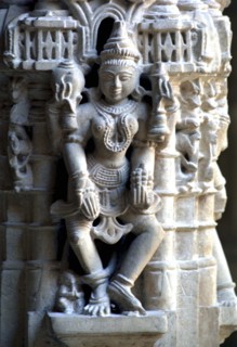 INDIA, Rajasthan, Mt Abu, Decorative carved marble figure at one of the Dilwara Temples