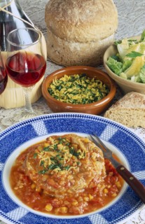 ITALY, Food and Drink, "Ossobucco, a dish of braised shin of veal served with bread salad and red