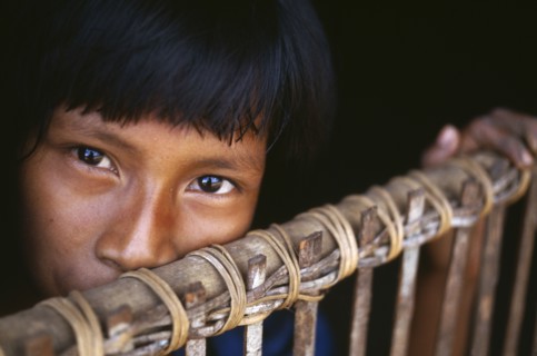 COLOMBIA, Amazonas, Santa Isabel, "Camilla, a Macuna Indian girl at the gate of her maloca. "