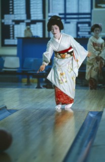 JAPAN, Honshu, Tokyo, Geisha girl in bowling alley.