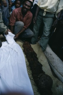 MADAGASCAR, Festivities, Merina Famadihana or bone turning festival.  Man with disinterred remains