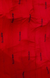 GHANA, Ashanti , Close up of traditional red Ashanti funeral cloth with pattern of swords.