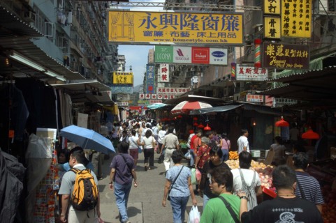 HONG KONG, General, Streetscene with shoppers and advertising banners overhead