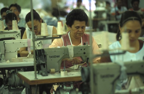 SOUTH AFRICA, Western Cape, Cape Town, Female sewing machine operators at Pre Les bedroom textiles