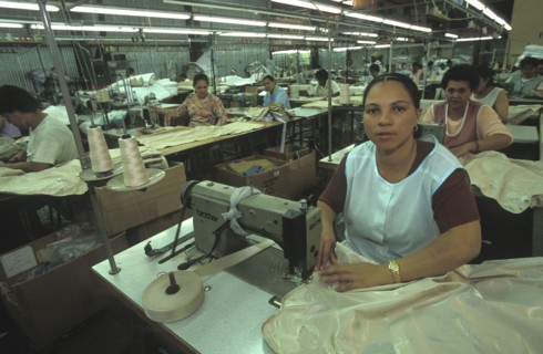 SOUTH AFRICA, Western Cape, Cape Town, Female sewing machine operators at Pre Les bedroom textiles