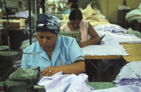 SOUTH AFRICA, Western Cape, Cape Town, Female sewing machine operators at Pre Les bedroom textiles
